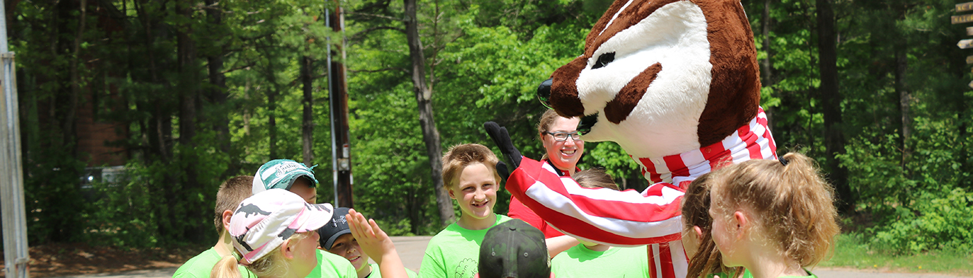 bucky the badger mascot with a group of children