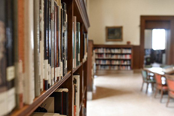 Books on a shelf in a library.