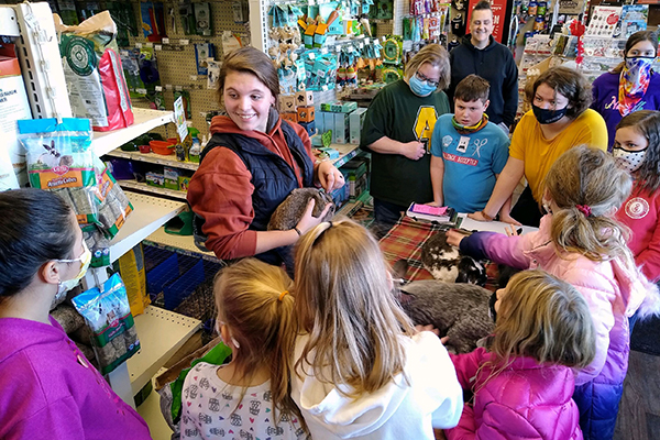 a group of 4-h kids viewing rabbits 