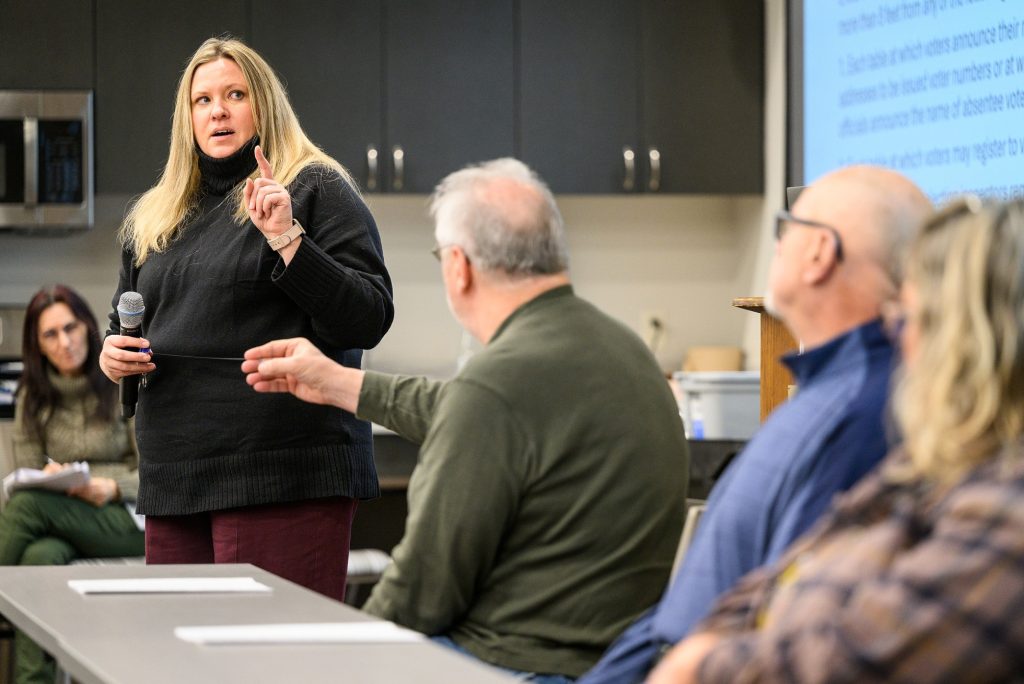 Melissa Kono, Associate Professor in Community Resource Development, speaking with a group of people